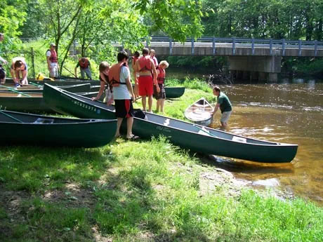 Kid preparing for the canoe launch