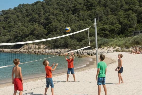 Family enjoying a lakeside campground with swimming and outdoor activities