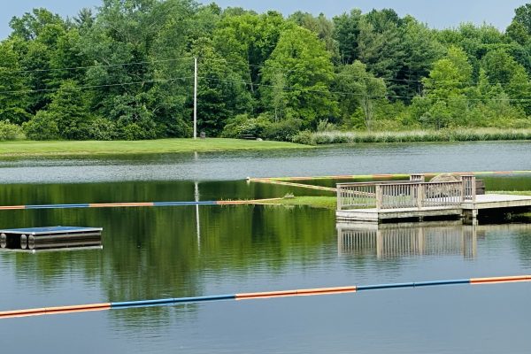 Swimming area and dock in the lake at Ridge Ranch Campground